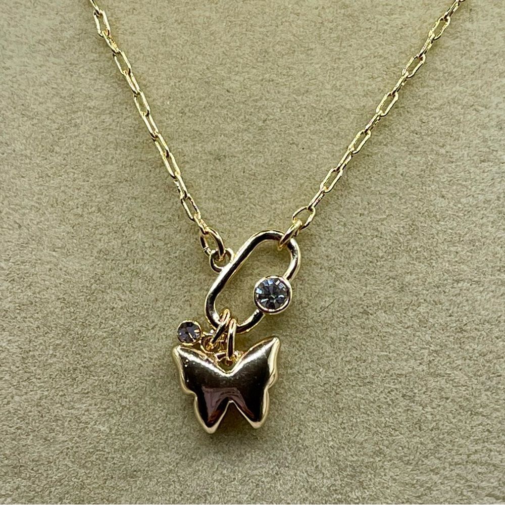 DKNY Gold Tone Crystal Polished Finish Butterfly Pendant Necklace. 16 inch long